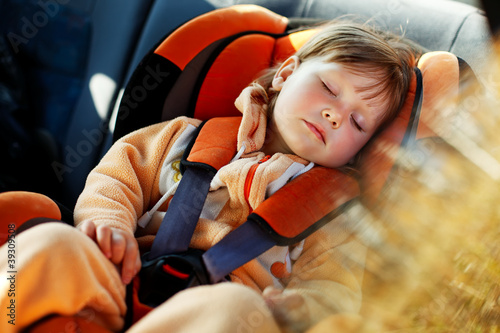 Photo: baby girl in car baby girl in car