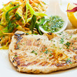 Sworfish steak with steamed vegetables and spices