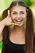 portrait of young woman speaking on imaginary phone
