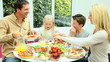 Video: Attractive Young Family Enjoying a Healthy Meal Attractive Young Family Enjoying a Healthy Meal