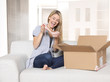 Foto: young woman unpacks her mail order: it's shoes young woman unpacks her mail order: it's shoes