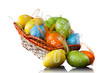 color easter eggs in basket isolated on white. top view