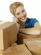 Woman with many packets calling a customer