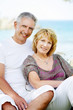 Mature couple smiling and embracing.