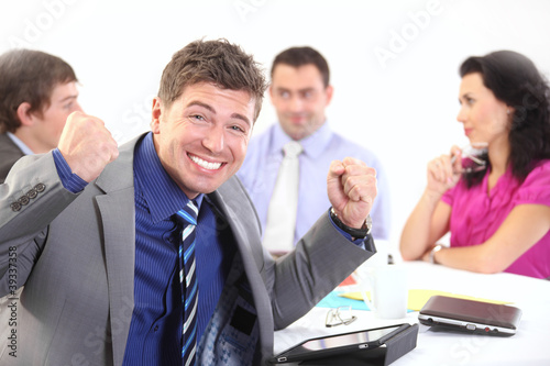 Photo: Successful businessman with his team Successful businessman with his team