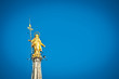 Golden Madonnina on the roof of Duomo cathedral. Milan, Italy.