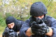 two armed policemen, aiming frontal view details