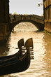 Prows of two gondolas in Venice