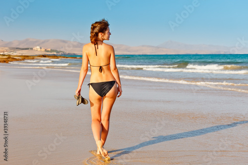 Photo: Young woman on the beach Young woman on the beach