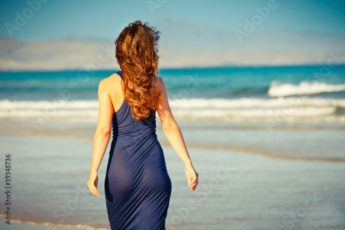 Photo: Young woman on the beach Young woman on the beach
