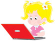 little girl typing on her laptop computer