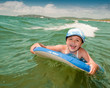Bodysurfing - young girl surfing in the sea