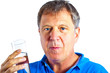 man drinking water out of a glass man drinking water out of a glass
