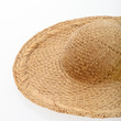 An unadorned woven straw sunhat or sombrero