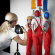 Foto: Photoshoot with three workmen painting a white wall Photoshoot with three workmen painting a white wall