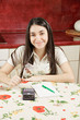Optimistic housewife with calculator