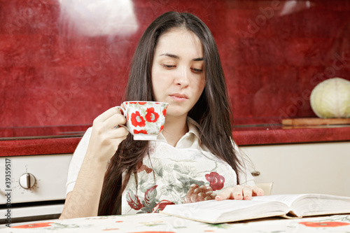 Photo: Housewife reading book Housewife reading book