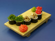 Photo: Delicious sushi rolls on wooden plate with ginger and wasabi. Delicious sushi rolls on wooden plate with ginger and wasabi.