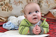 Lying child with interested