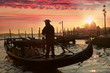 Gondolier against sunset in Venice, Italy Gondolier against sunset in Venice, Italy