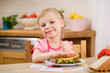 little girl with sandwich