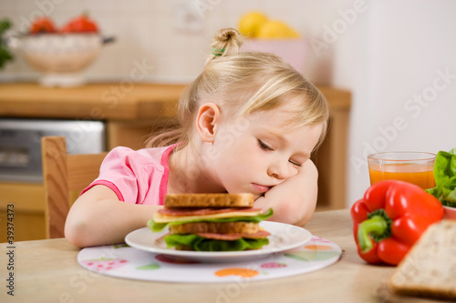 Photo: little girl eating? sandwich little girl eating? sandwich