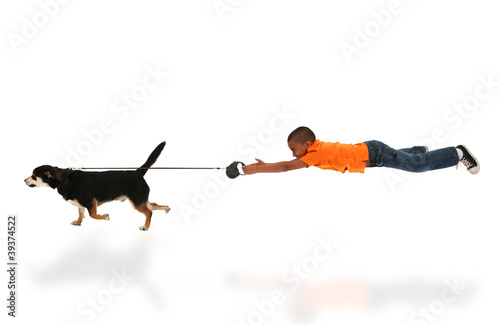 Photo: Dog Taking Happy Handsome Black Boy Child for Walk Dog Taking Happy Handsome Black Boy Child for Walk
