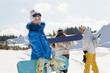 Three young snowboarders