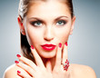 Woman with bright red manicure