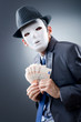 Businessman with money and mask
