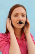 Redhead pretty woman with headset