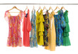 colorful clothes choice of casual clothes on wooden hangers