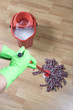 cleaner is mopping wooden parquet floor