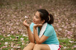 Pretty Thai woman looking flower after exercise .