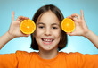 Little girl with oranges
