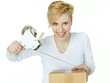 Young woman at work wraps up a packet for delivery