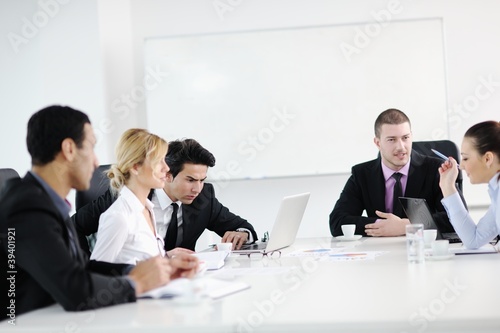 Photo: Group of young business people at meeting Group of young business people at meeting