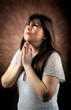 a girl prays in God