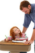 Teacher or Father Helping Elementary Student at Desk