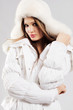 Beautiful woman in white winter clothes