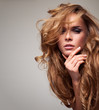 Photo: Portrait of delicate blonde woman with copy space Portrait of delicate blonde woman with copy space