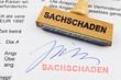 Holzstempel auf Dokument: Sachschaden