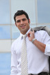 Businessman holding his suit jacket over his shoulder