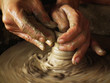 Close-up of potter turning a pot on a potter