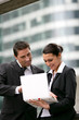 Business couple stood in the city