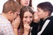 Teenagers gossiping about their mutual friend