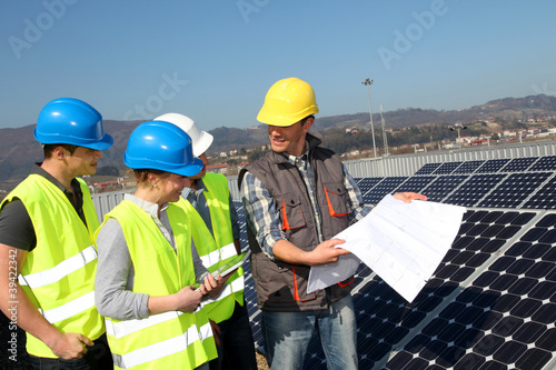 Engineering professional with group of students in training
