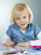 Cute blonde enjoys to paint a picture for art lessons