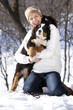 Foto: Bernese sennenhund puppy and girl. Bernese sennenhund puppy and girl.