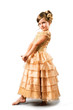 little girl posing in gold gown isolated on white background